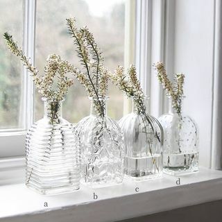 Vase bouteille carrée en verre pressé