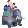 Vous pouvez acheter une pelouse gonflable du père Noël sur un éléphant