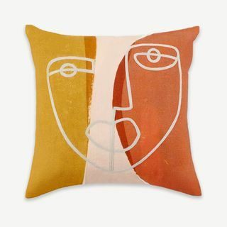 Coussin visage brodé